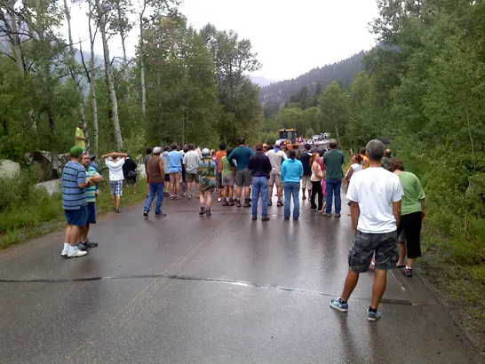 people crowd around at mud slide in Marble, Colorado